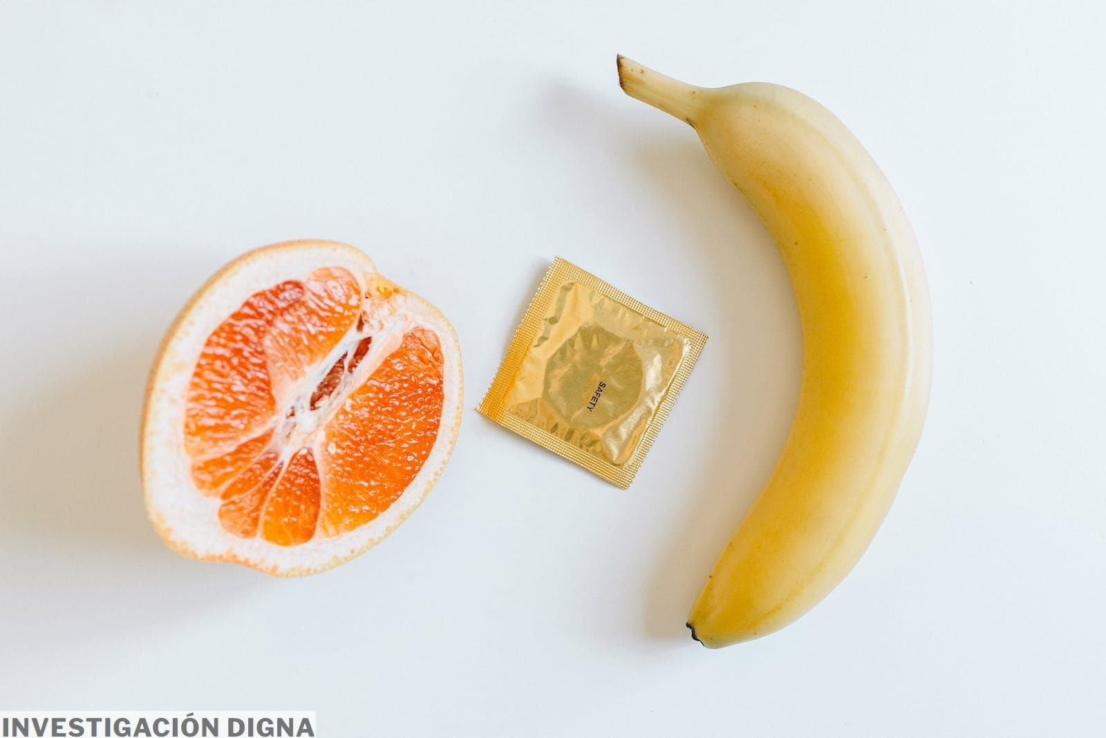 Condom Between Orange and Banana