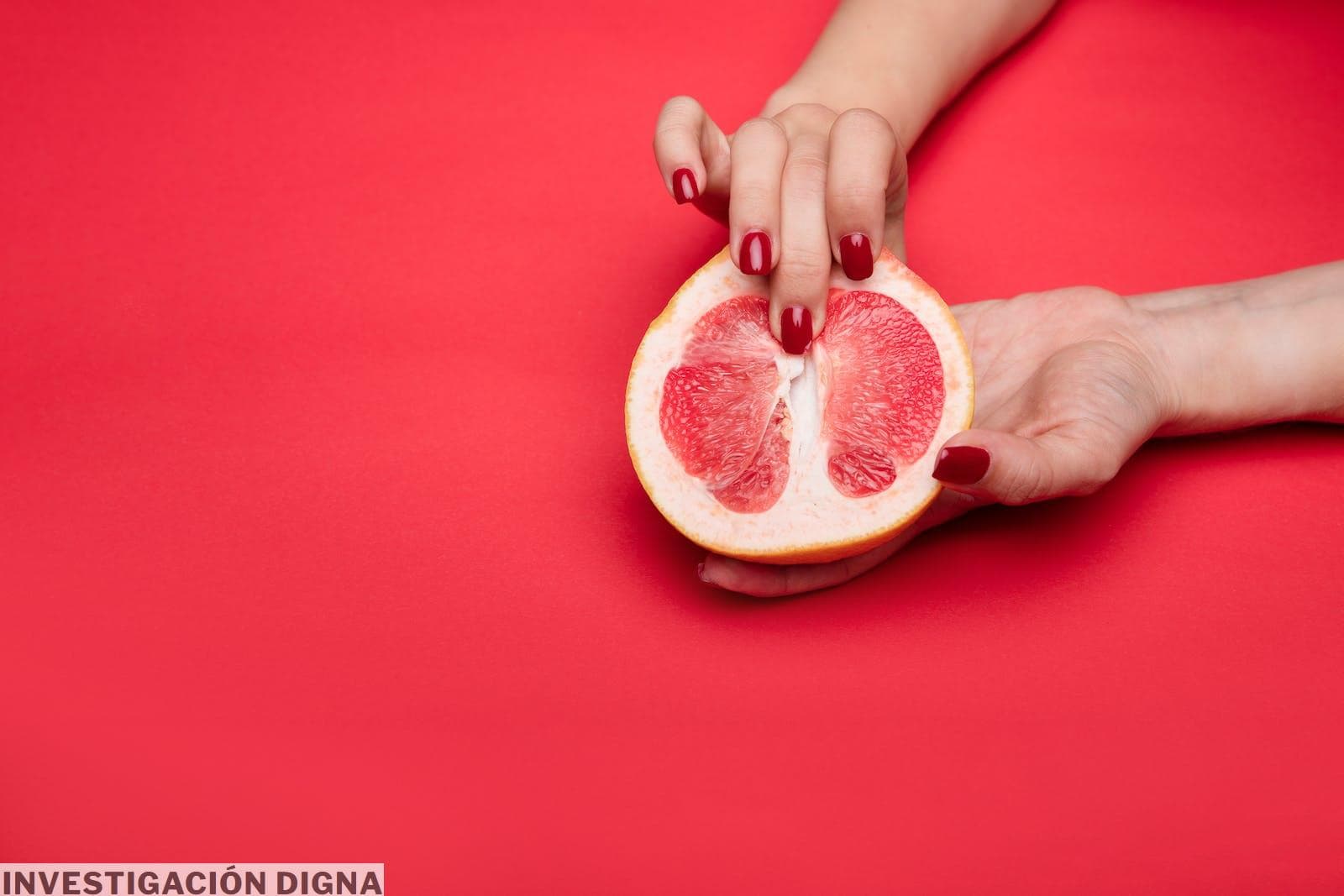 Finger on Sliced Grapefruit